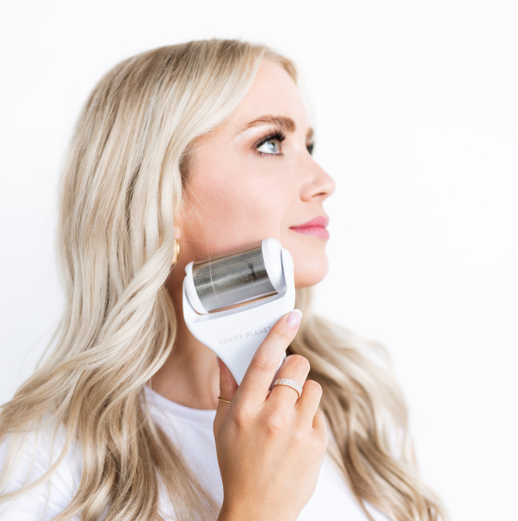 aesthetician haley everett of HD Skin Dallas Texas using an ice roller for puffiness on her face