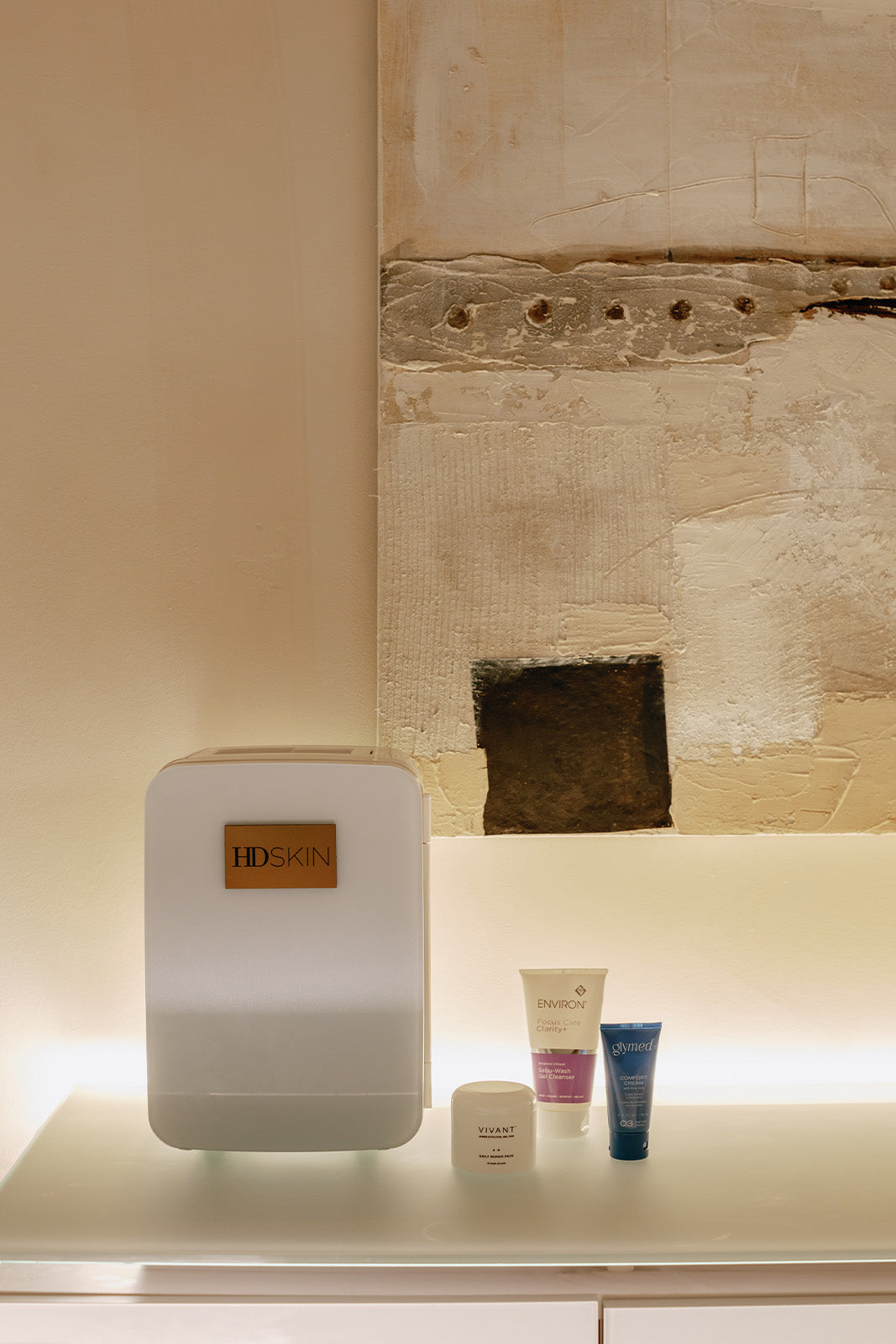 HD Skin Dallas Texas relaxing treatment room ambient lighting, skincare fridge filled with products