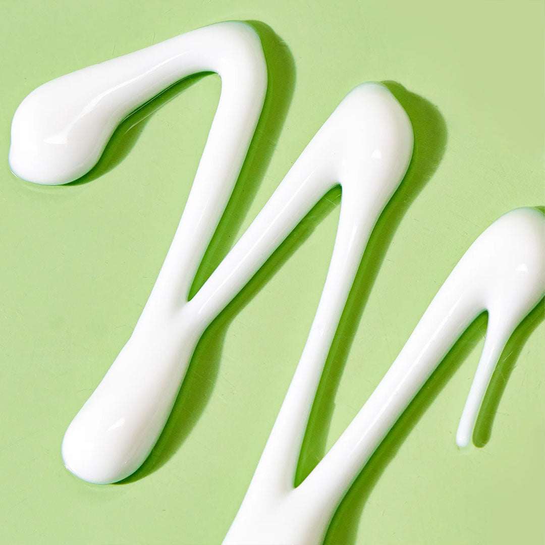 BIOME+ Cleansing Comfort Balm jar with natural skincare ingredients on wooden surface