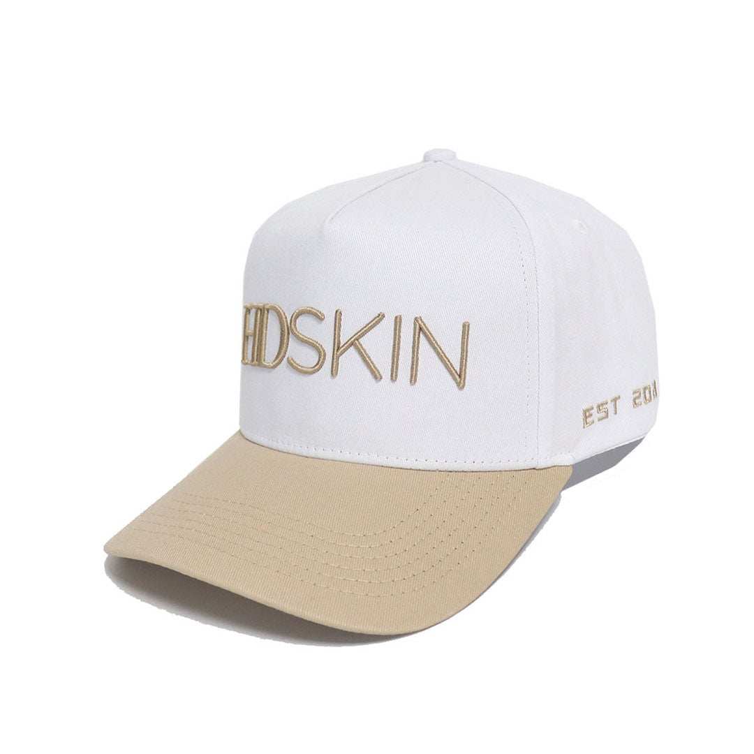 White cotton baseball hat with embroidered logo and snapback adjustment for comfort and style