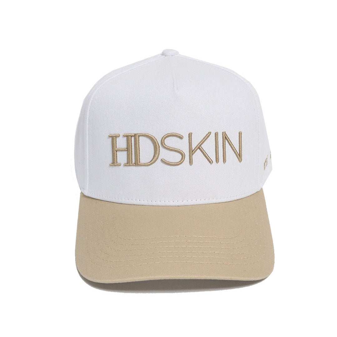 White cotton baseball hat with embroidered logo and snap back adjustment