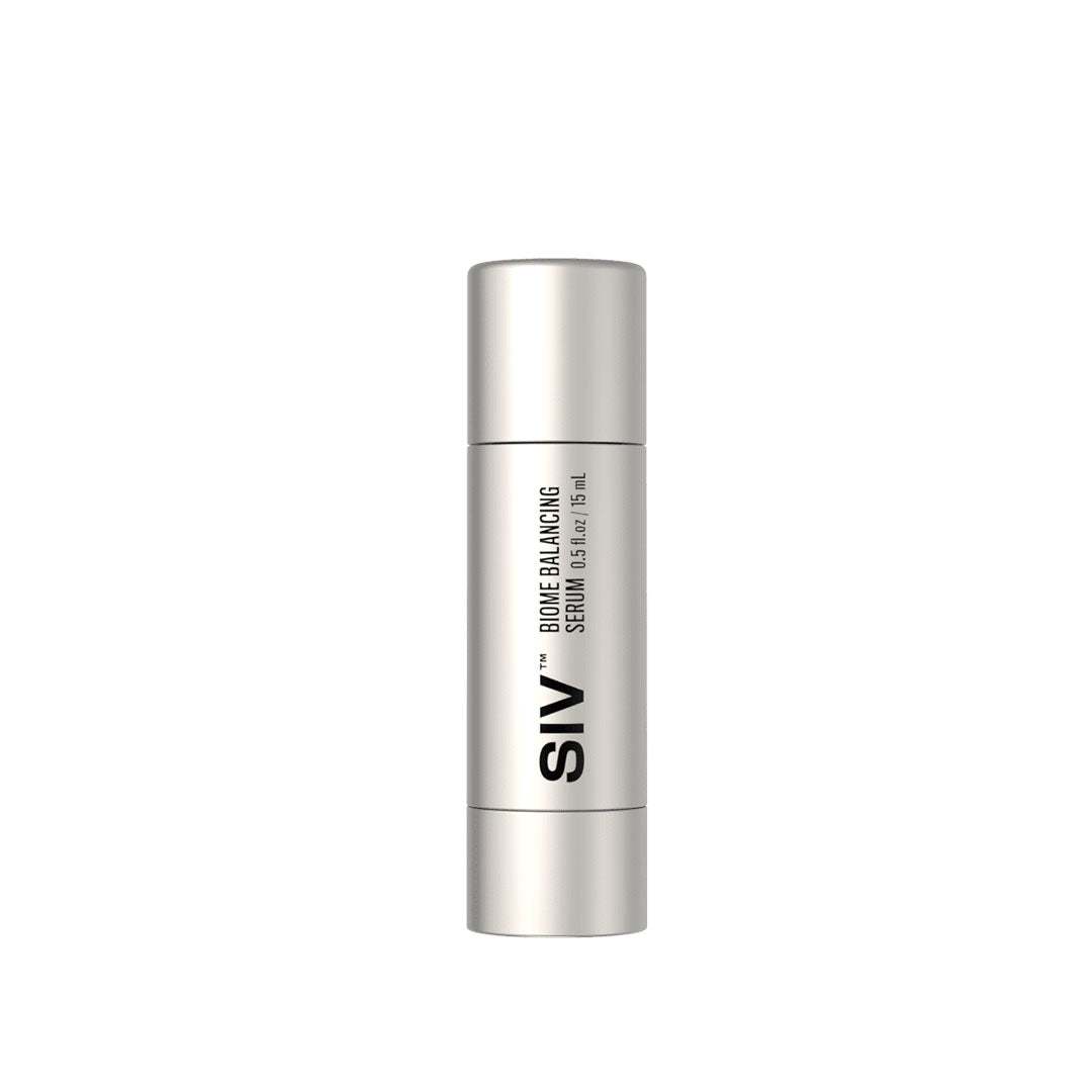Biome Balancing Serum bottle with natural skincare ingredients on wooden background