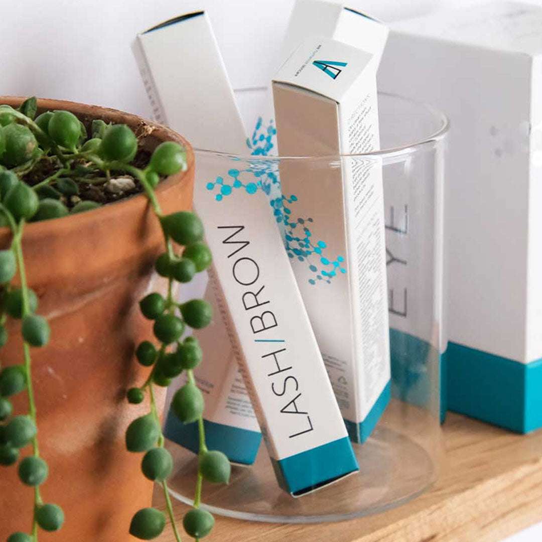 Lash and Brow Growth Serum bottle with natural ingredients for thicker lashes and brows