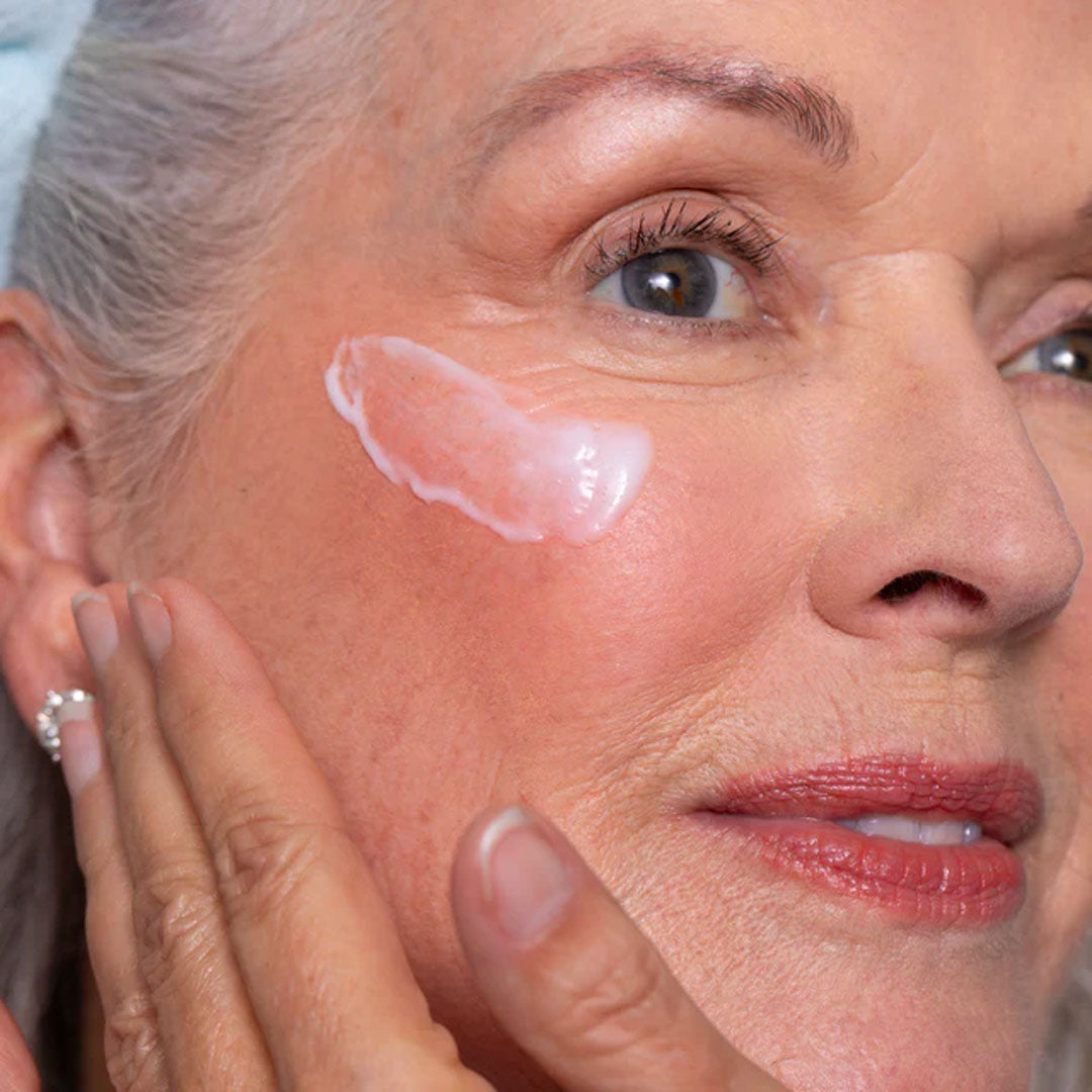 woman applying Barrier Balance Creamy Cleanser by Face Reality to face