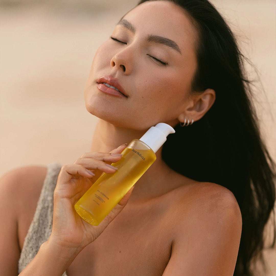 Daily Restorative Cleansing Oil bottle with natural ingredients for gentle exfoliating and deep skin cleansing