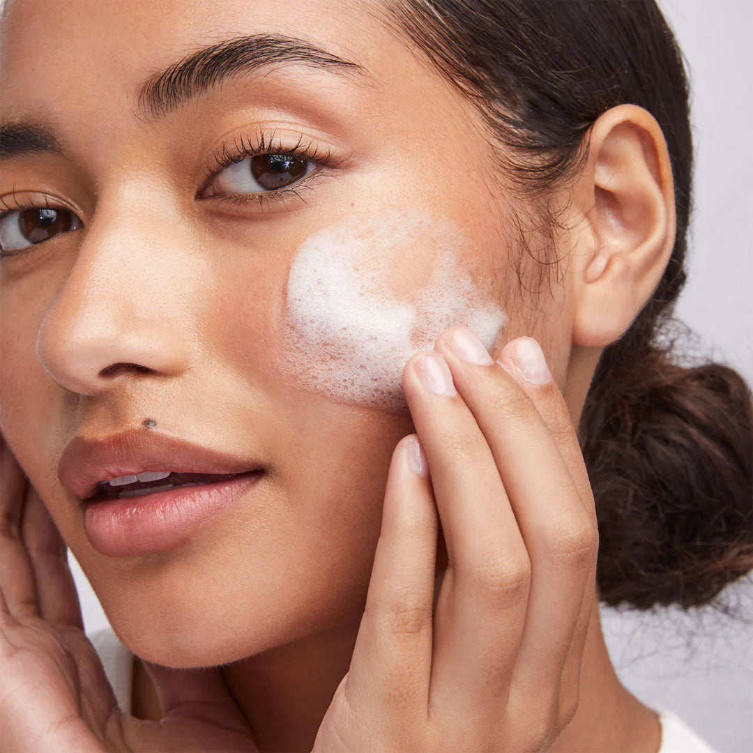 woman using colorescience Barrier Pro™ 1-Step Cleanser