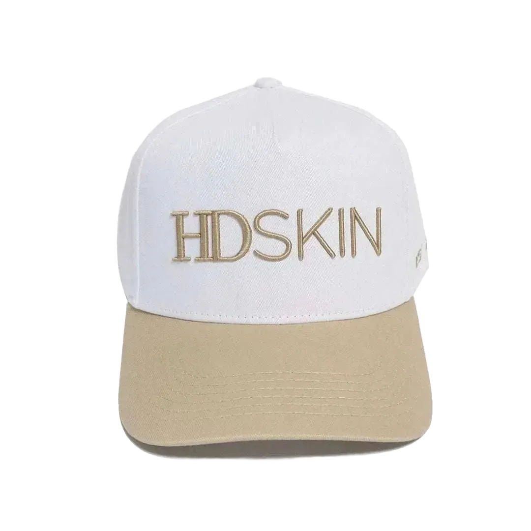 White cotton baseball hat with embroidered logo and snap back adjustment