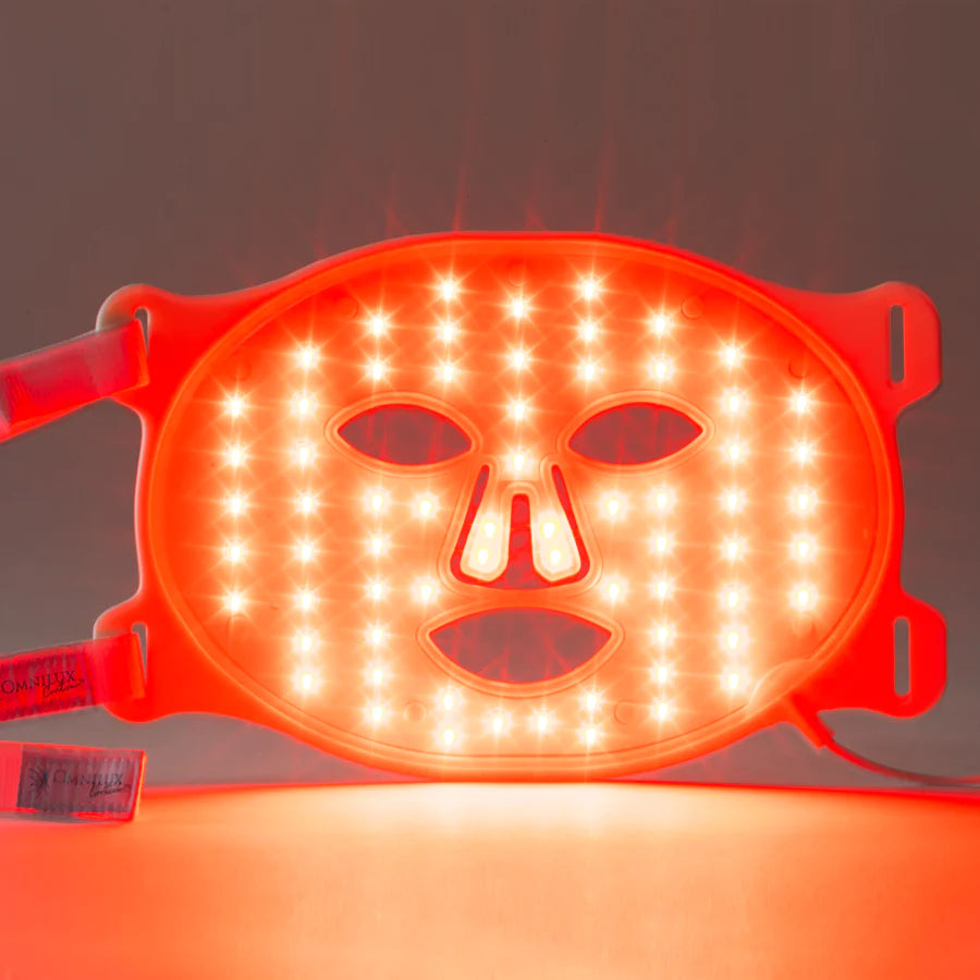 omnilux led light therapy face mask with lights on