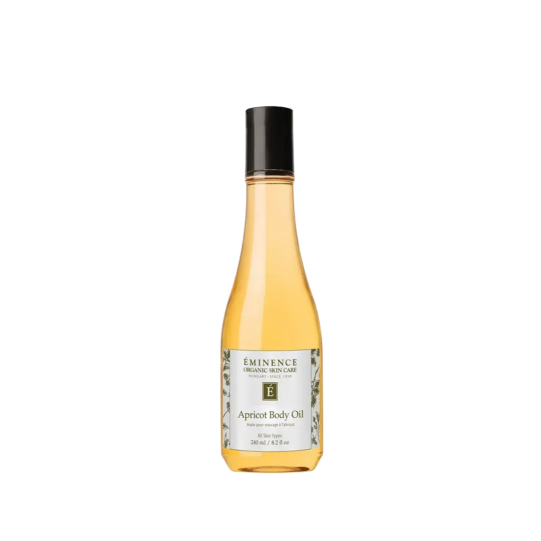 8.2 oz bottle of Eminence Apricot Body Oil with a black cap and golden liquid in a clear glass bottle.
