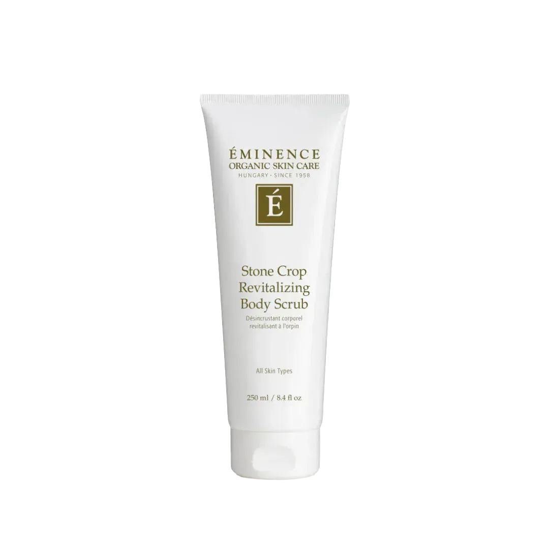 White 8.4 oz squeeze tube of Eminence Stone Crop Revitalizing Body Scrub with green logo and text on a white background.